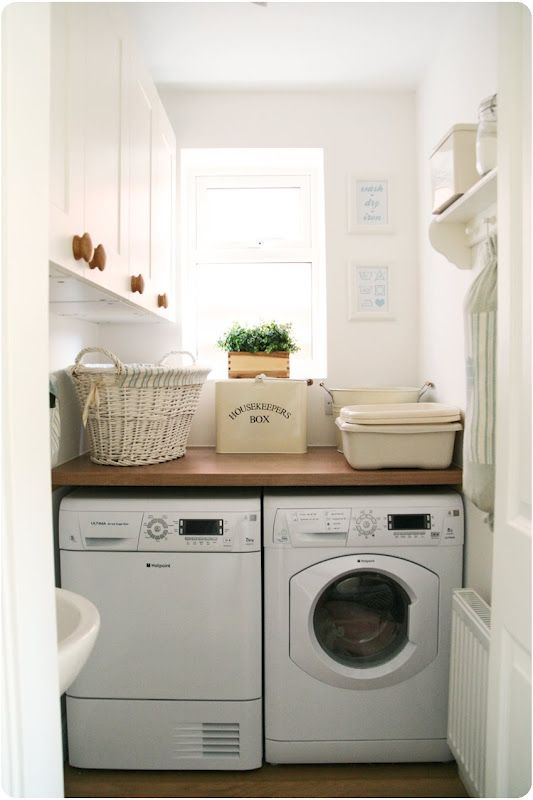 Tiny laundry room idea:  Solid shelf over the washer/dryer and lots of cabinets on side wall make this a great small laundry room layout.