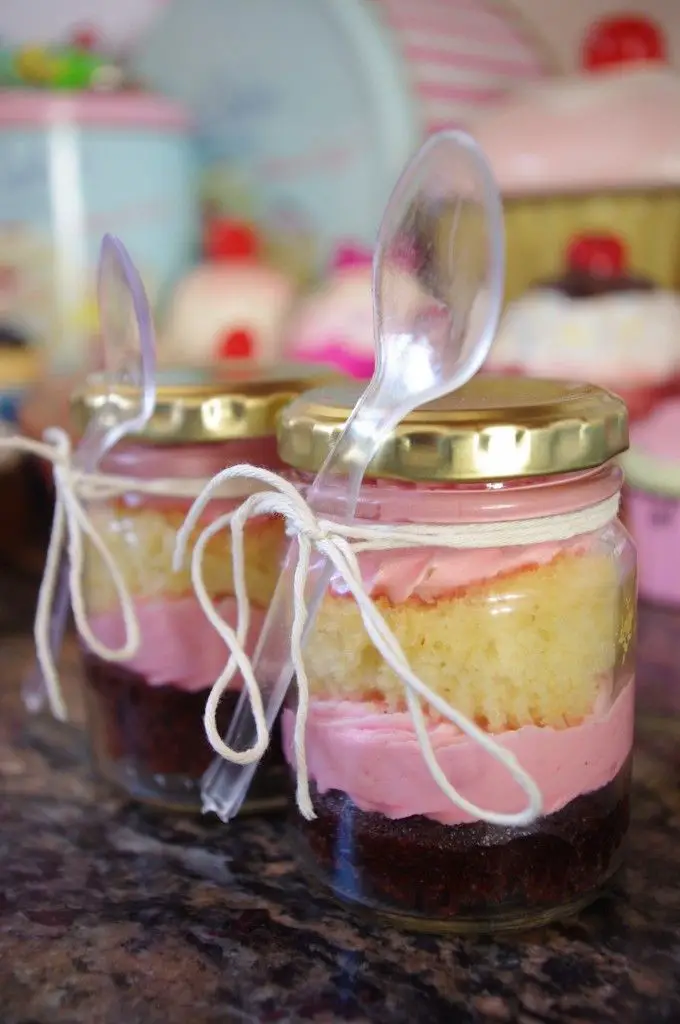 Mason Jar Cupcakes and Cake in a Jar ideas - We think these cupcakes in a jar would be great for a baby shower - love the bright pink icing.  Another idea:  plan these cupcakes in mason jars with both blue icing and pink icing for a gender reveal shower.
