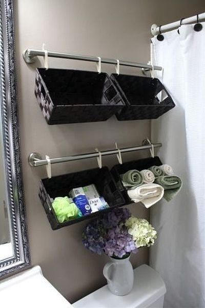 Isn’t this CLEVER? And sure makes good use of the space over the toilet instead of using shelves.