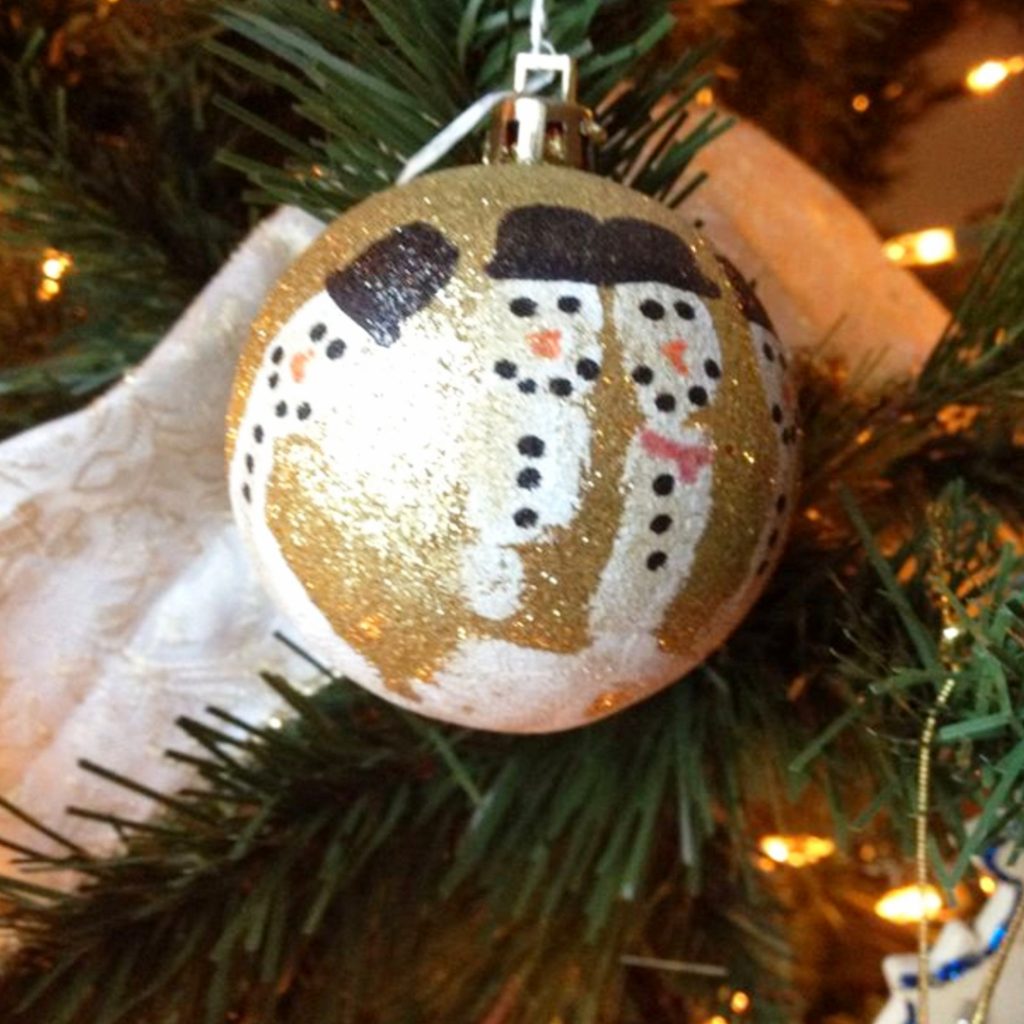 The CUTEST Snowman Handprint Ornaments To DIY With Your Kids - Clever DIY Ideas