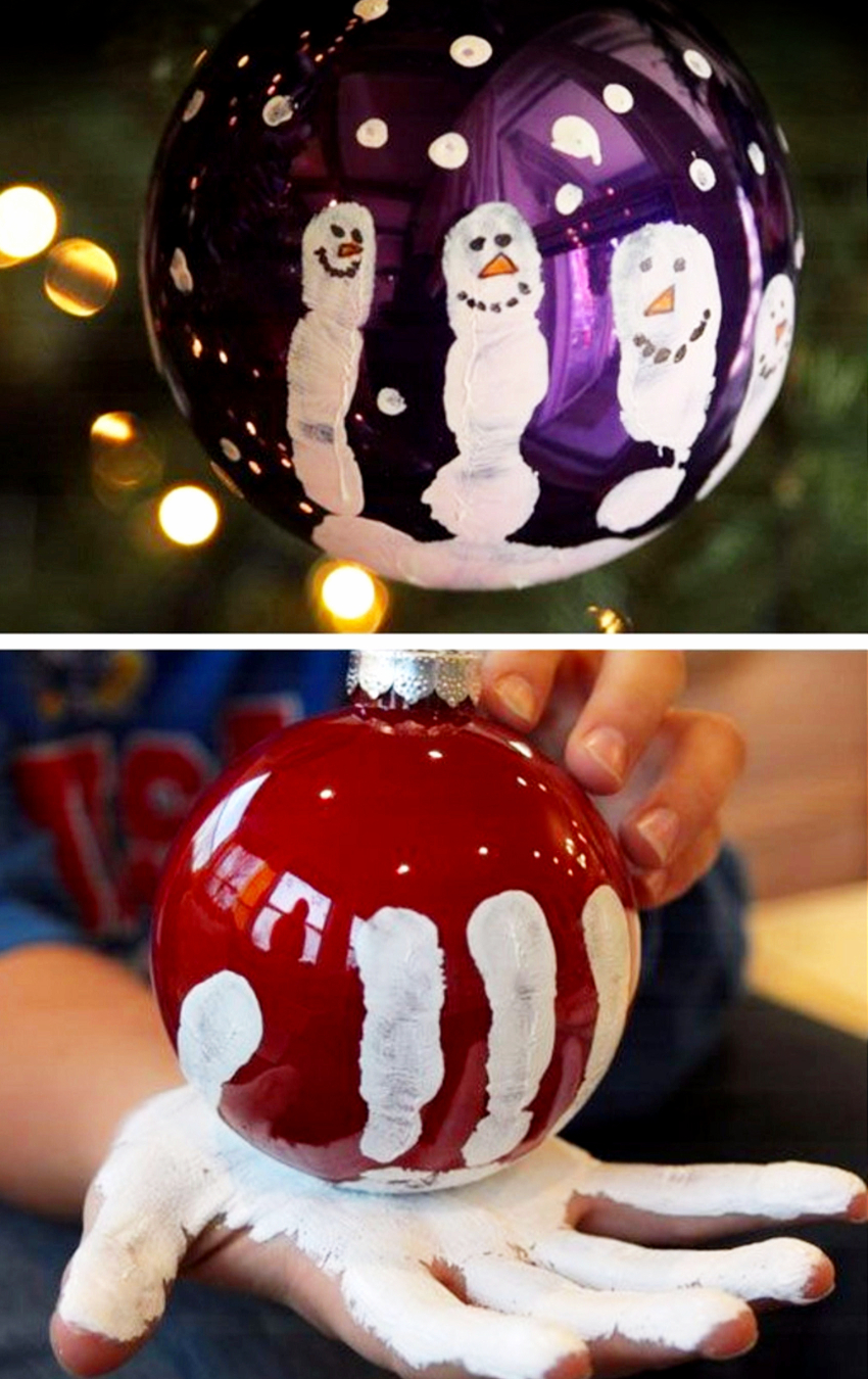 DIY Christmas ornament ball ornaments with kids handprints as snowman - cute and easy Christmas craft for kids