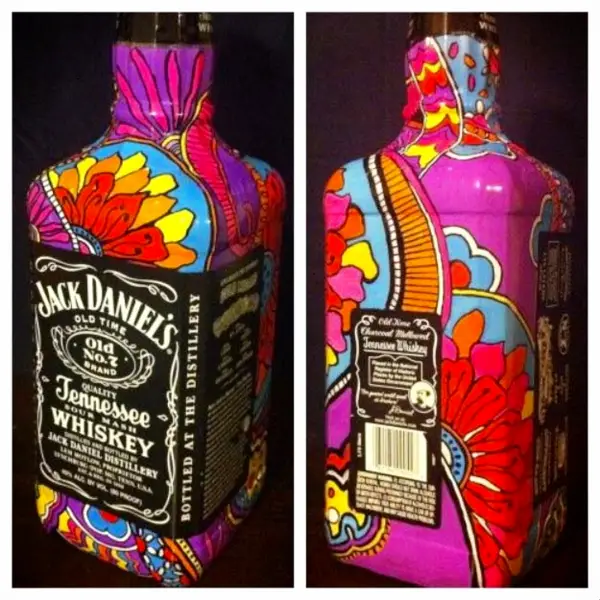 Jack Daniels Bottle Crafts - DIY painted Jack Daniels bottles make pretty decorations
