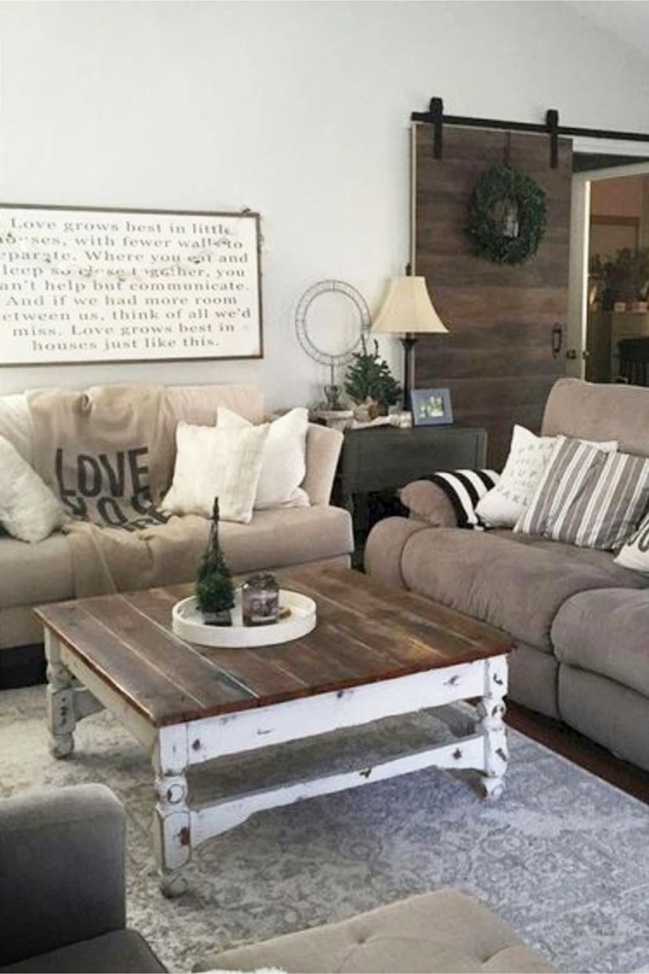 Gray farmhouse living room wall colors and decorating ideas - cozy grey small living room ideas on a budget in neutral colors with pops of color in the living room decor.