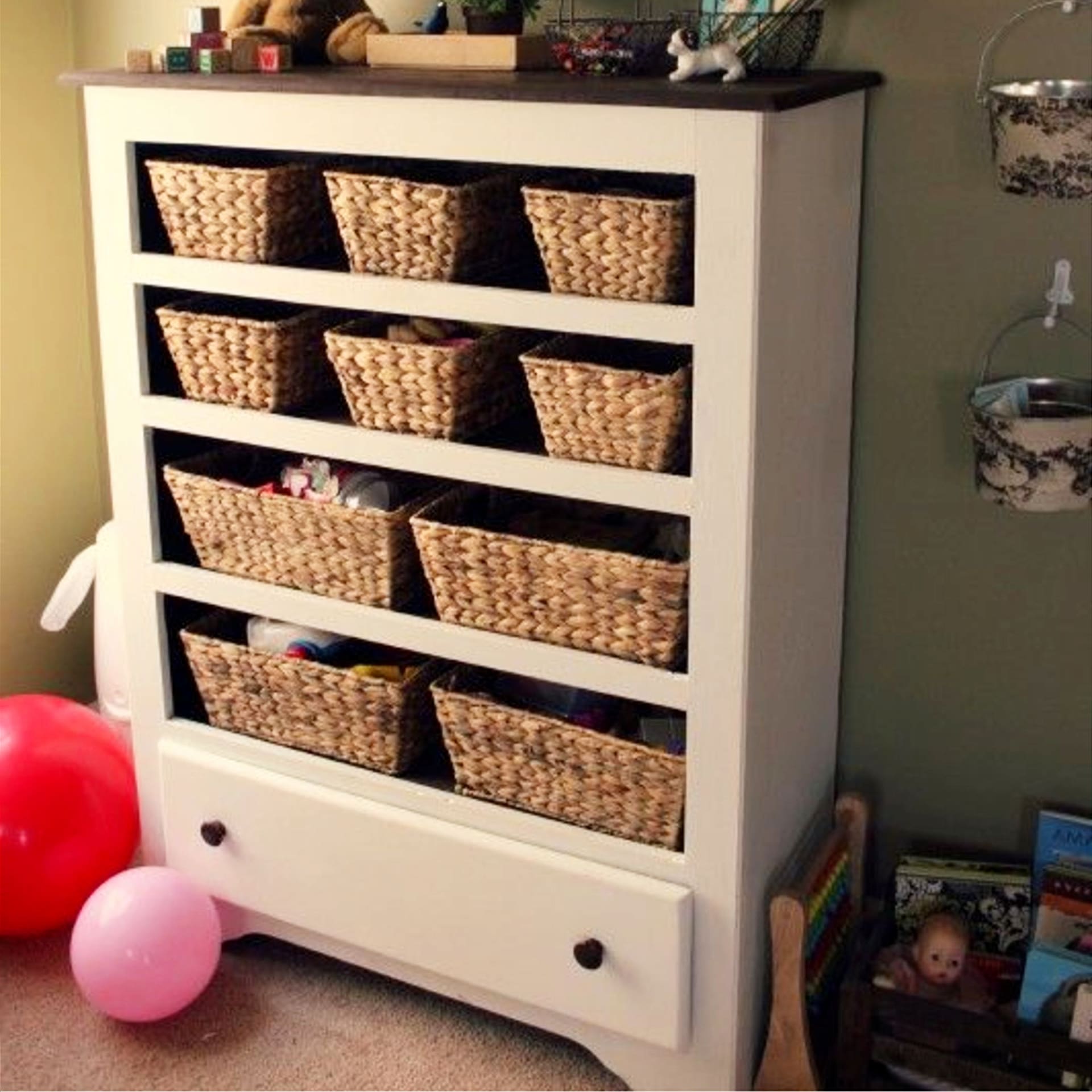 Thrift store repurposed furniture projects and ideas - repurposed dresser into a beautiful storage cabinet with baskets for the kids room or baby bedroom nursery.  Cheap repurposed furniture ideas