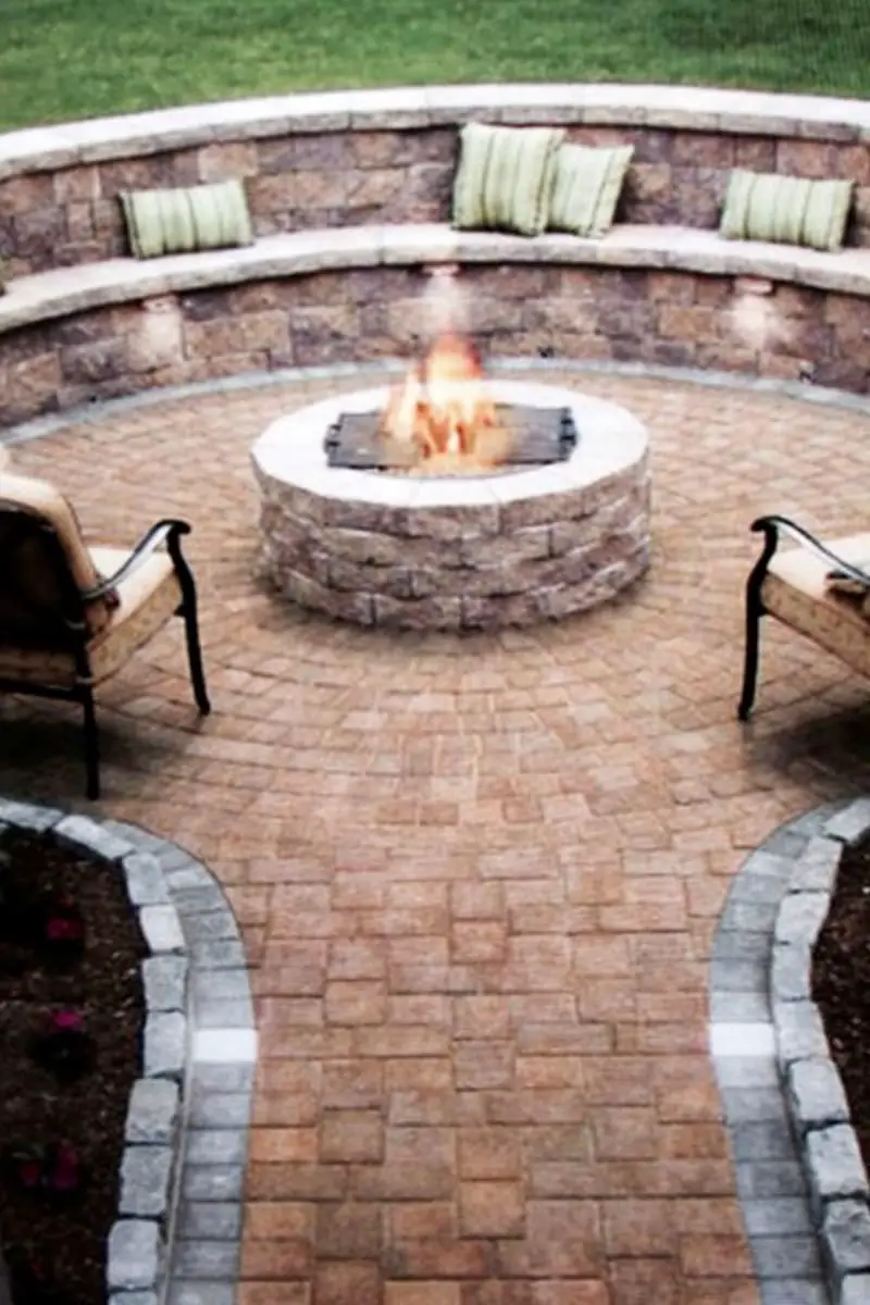 Stacked rock bench and wall fire pit seating idea