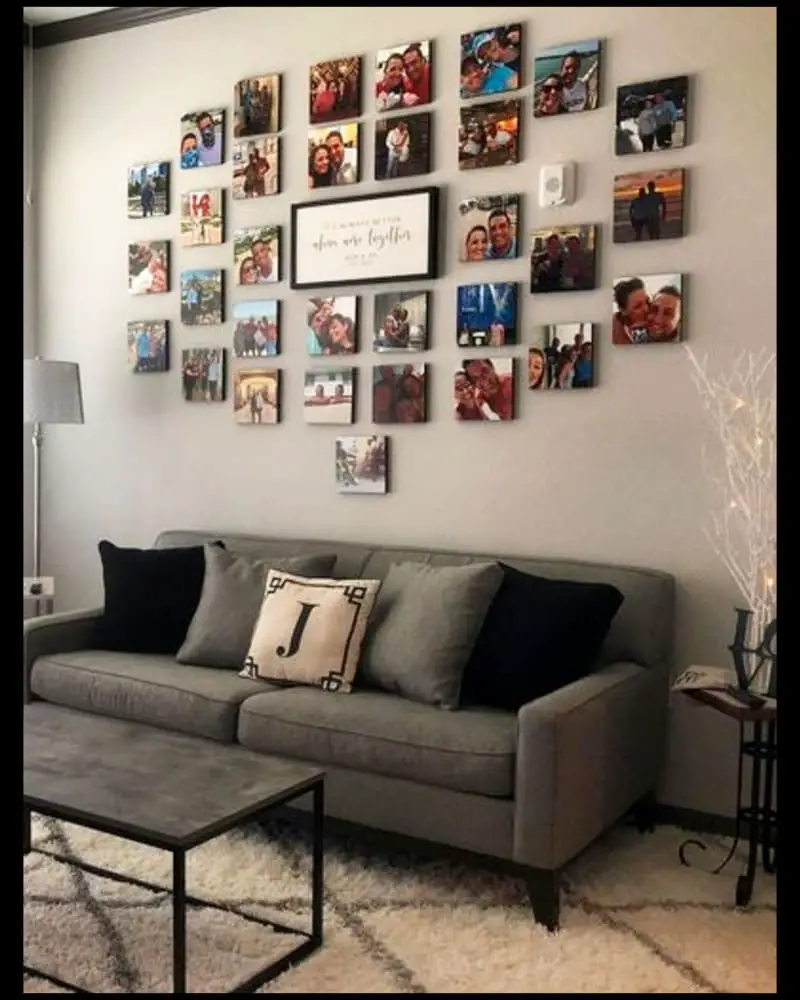Grey living room ideas-cosy small grey living room with family photo wall over the grey couch