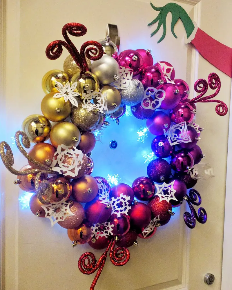 Grinch Christmas wreath made with Christmas tree ball ornaments and lights