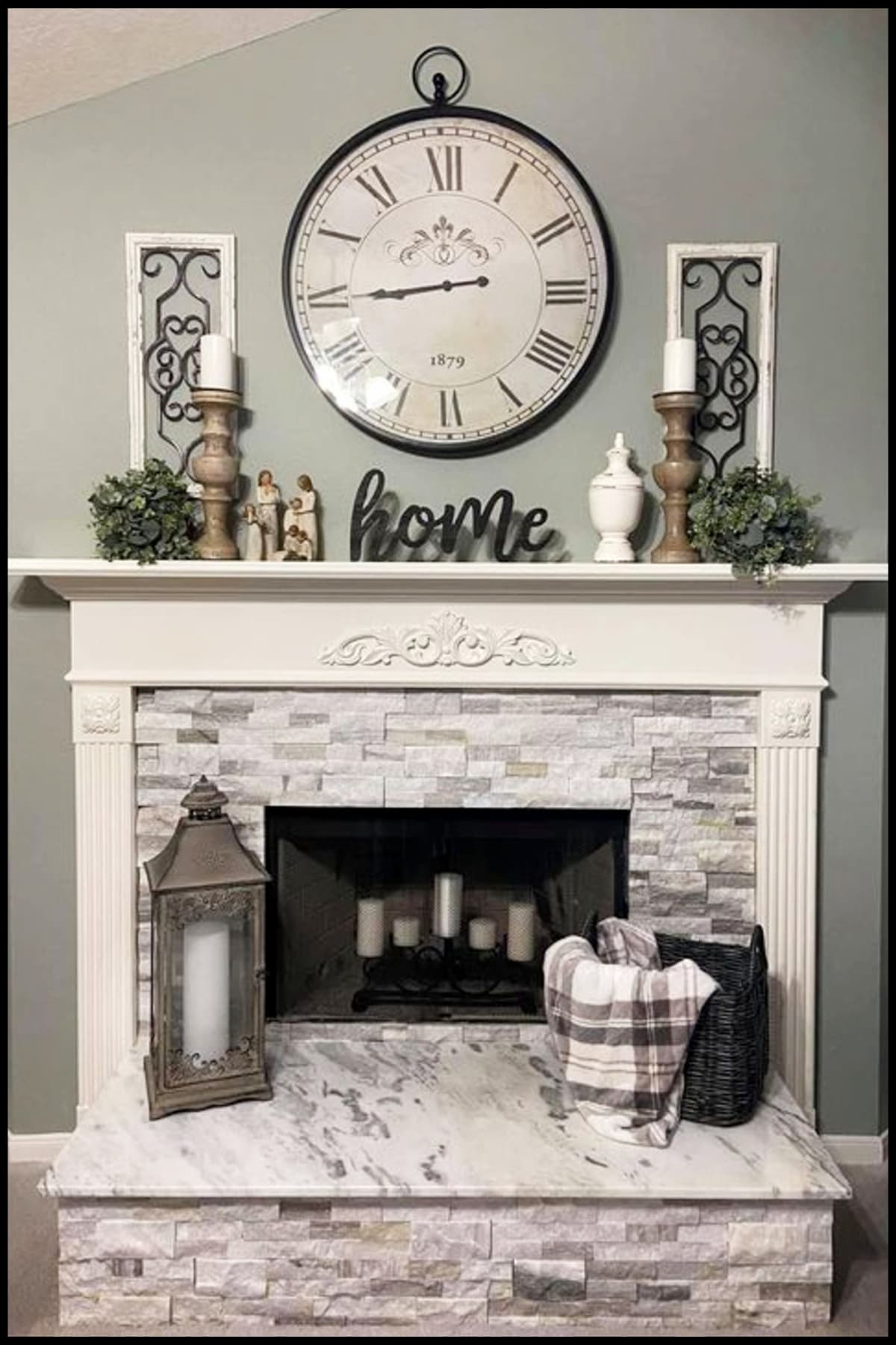 farmhouse fireplace ideas with clock over mantel, candle, baskets and throw blankets on hearth